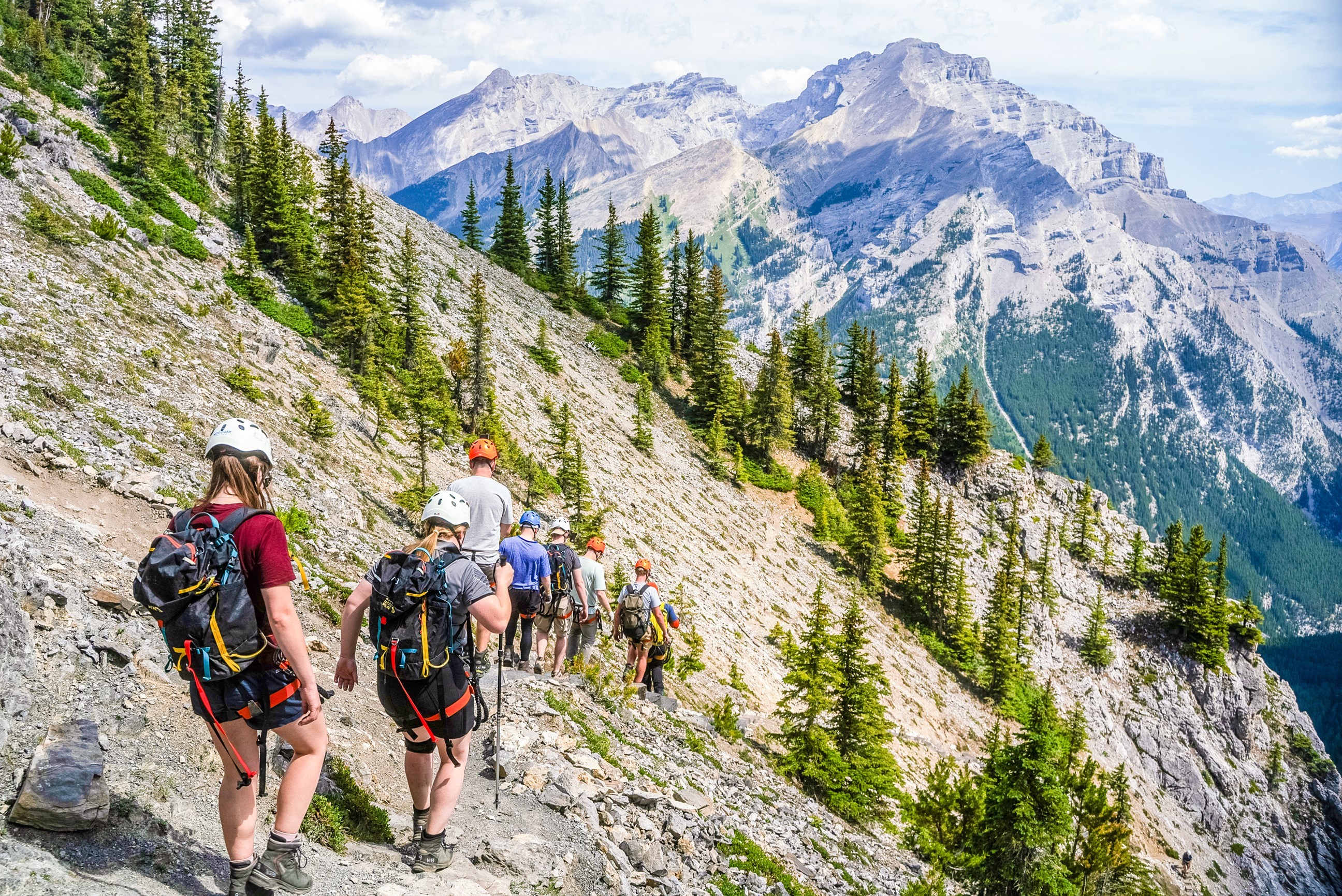 Travellers posing on a mountain in Banff, Canada