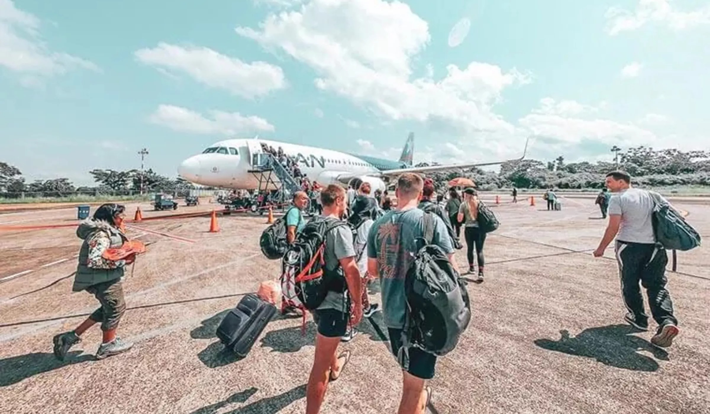 Pople boarding plane