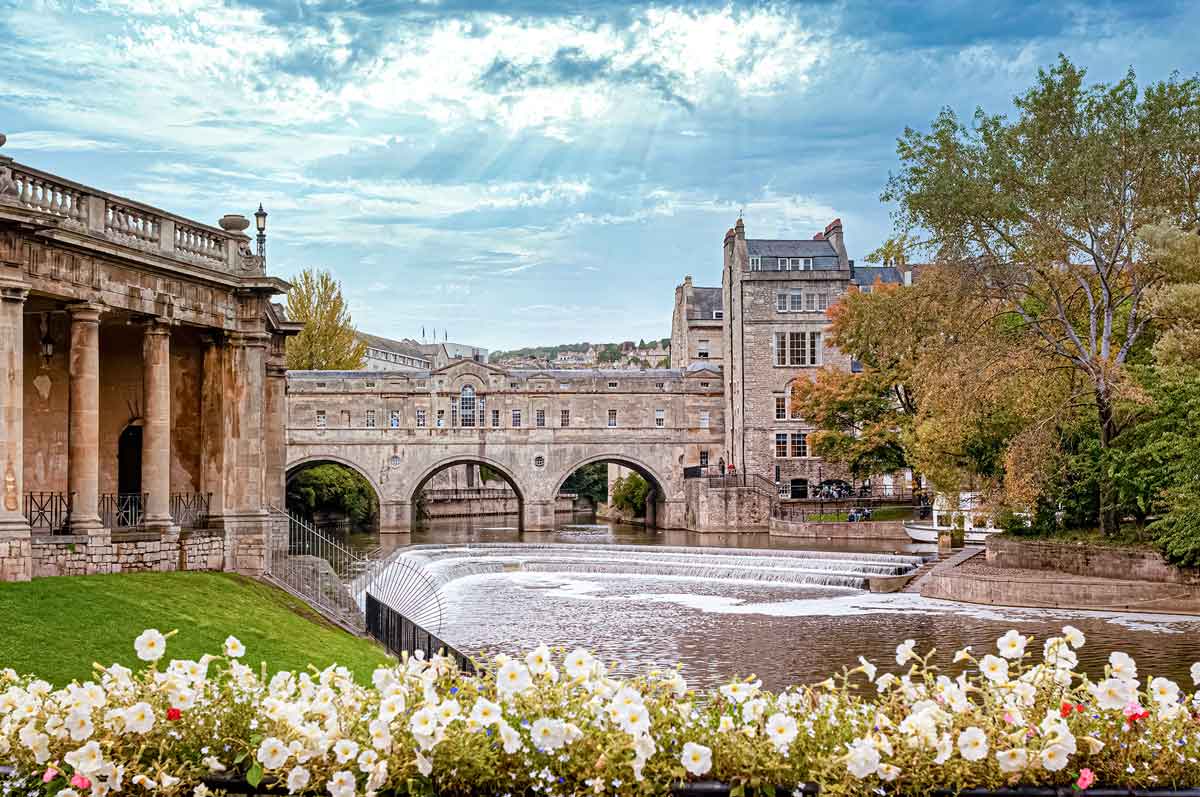 Classic Village In England With Bridge And River
