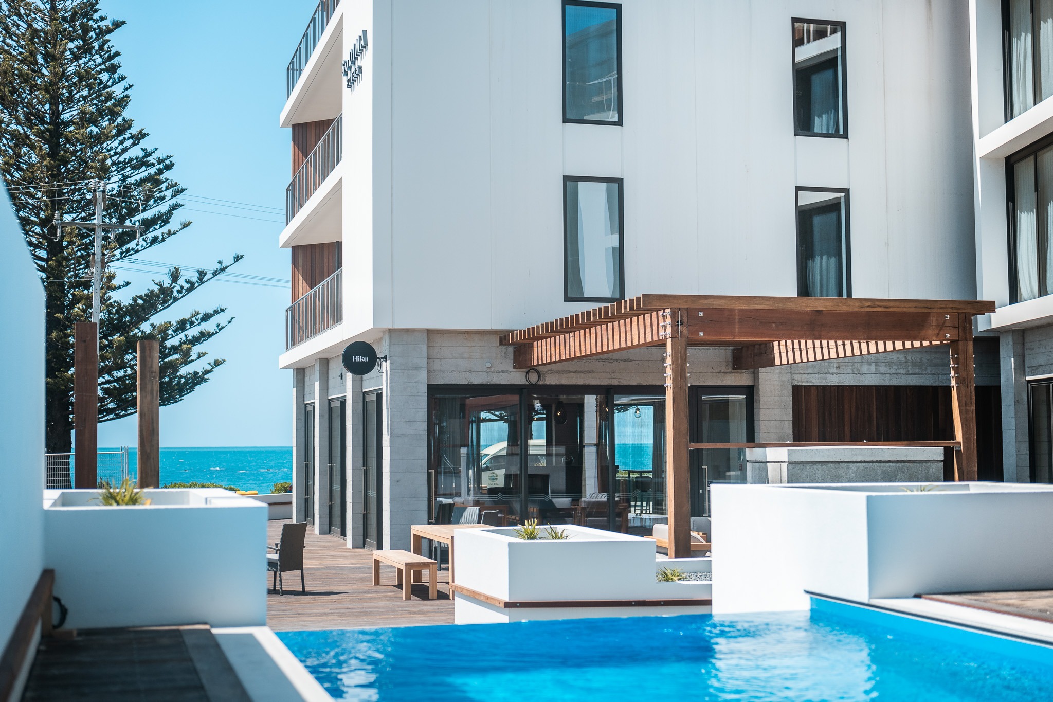 Swimming pool at hotel in sunny location, New Zealand