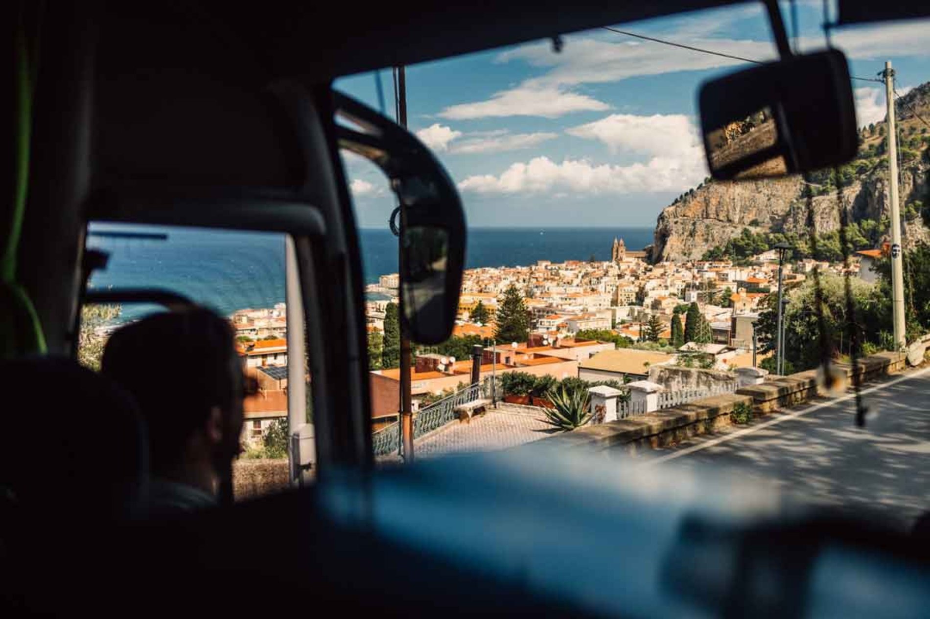 A person travelling by car in Italy