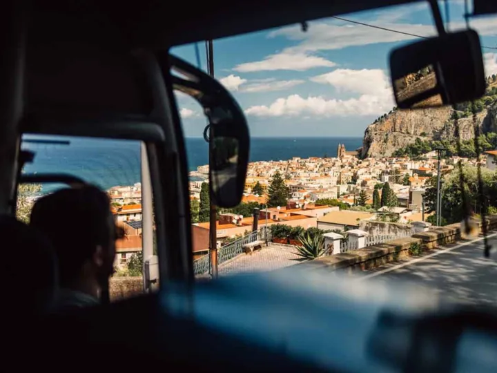 A person travelling by car in Italy