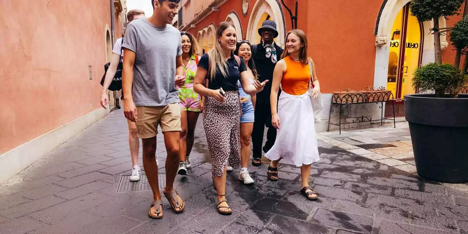 Group Of Young Travelers Exploring Europe