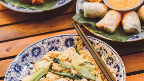 Close up on plates with Cambodian foods