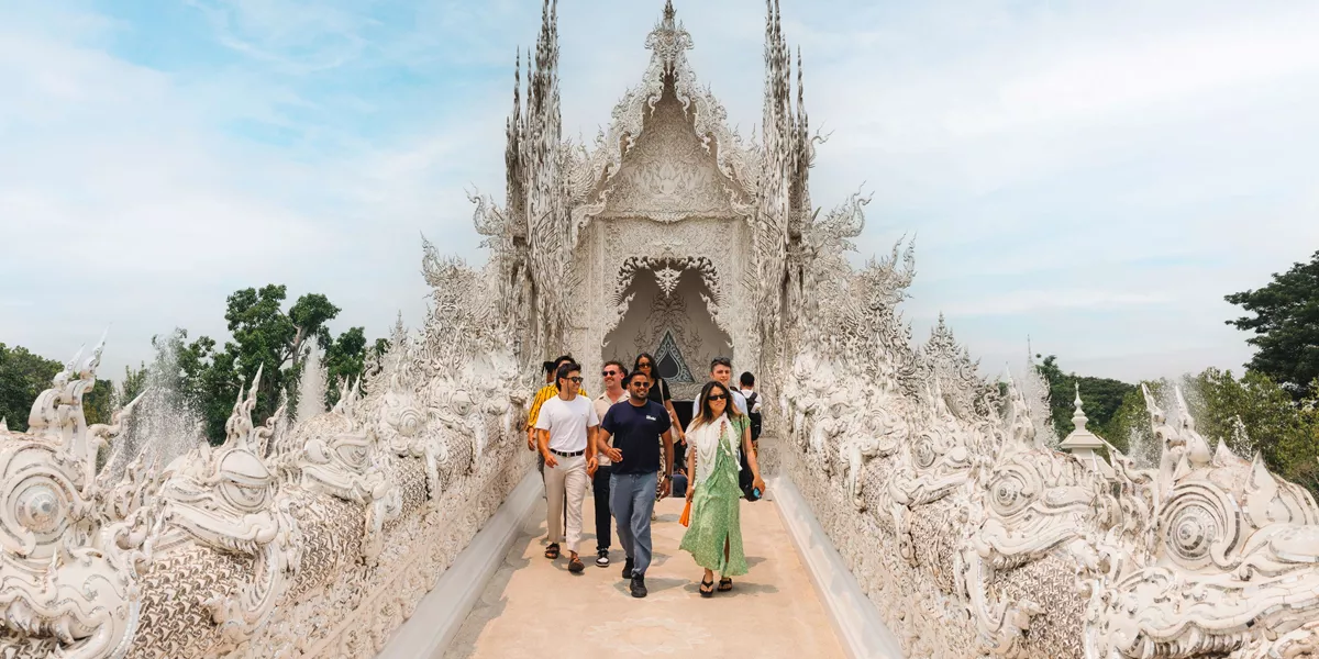 Group Walking Through Thai Temple