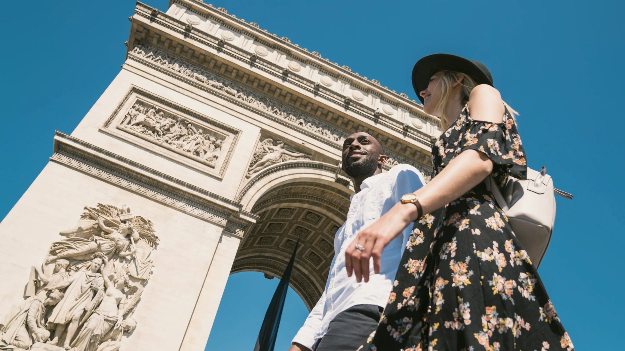 Contiki travellers visiting the Arc de Triomphe in Paris, France, during the London to Berlin by Train Tour, exploring iconic European landmarks and city sights