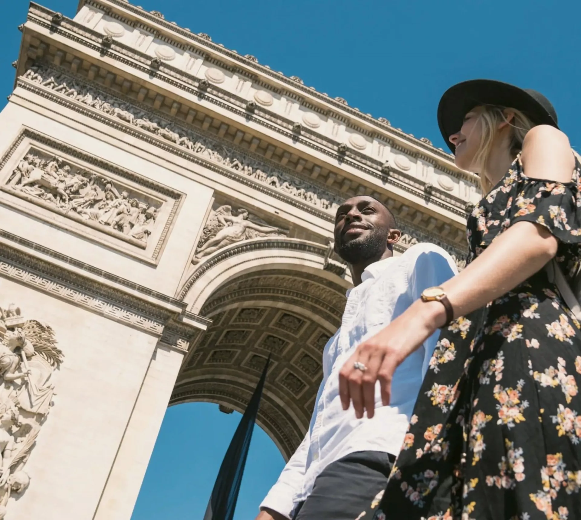 Contiki travellers visiting the Arc de Triomphe in Paris, France, during the London to Berlin by Train Tour, exploring iconic European landmarks and city sights