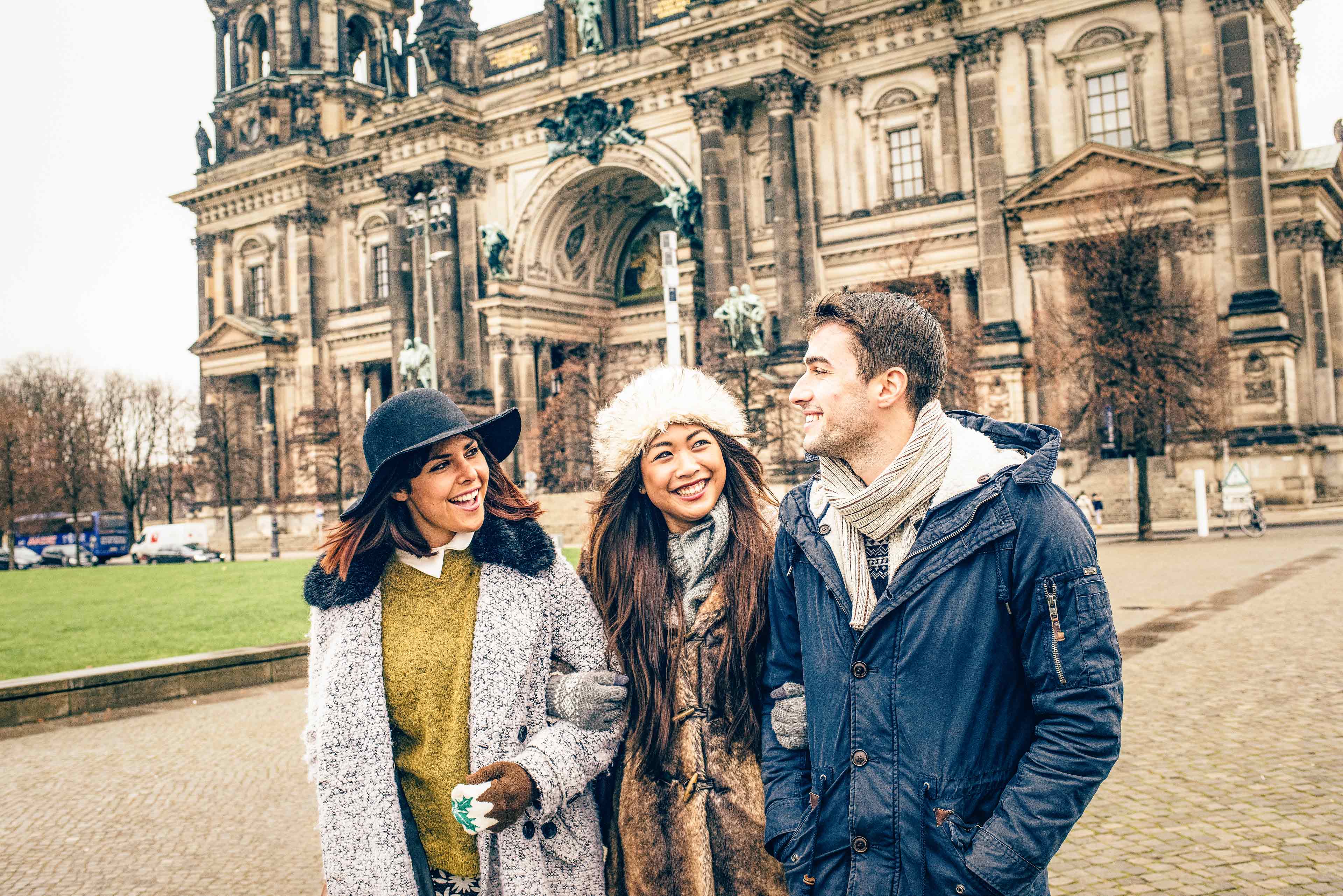 Group Of Young Travelers Exploring Berlin In Winter