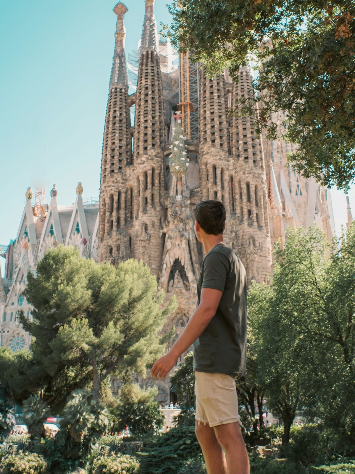 Traveller admiring the Sagrada Família in Barcelona, one of Spain's most iconic landmarks.