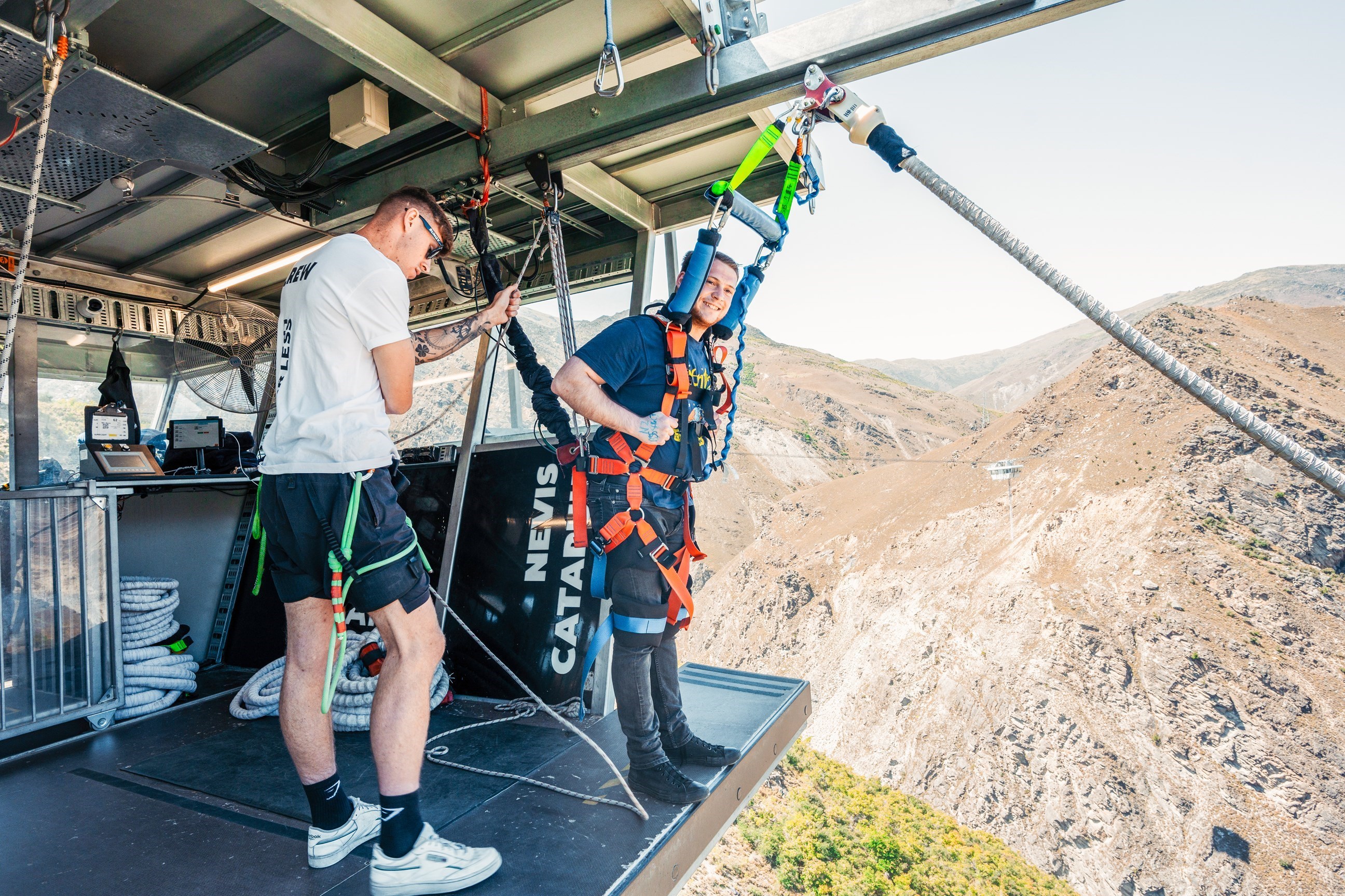 Traveller standing at the edge of the bridge ready to ride the catapult in Queenstown, New Zealand