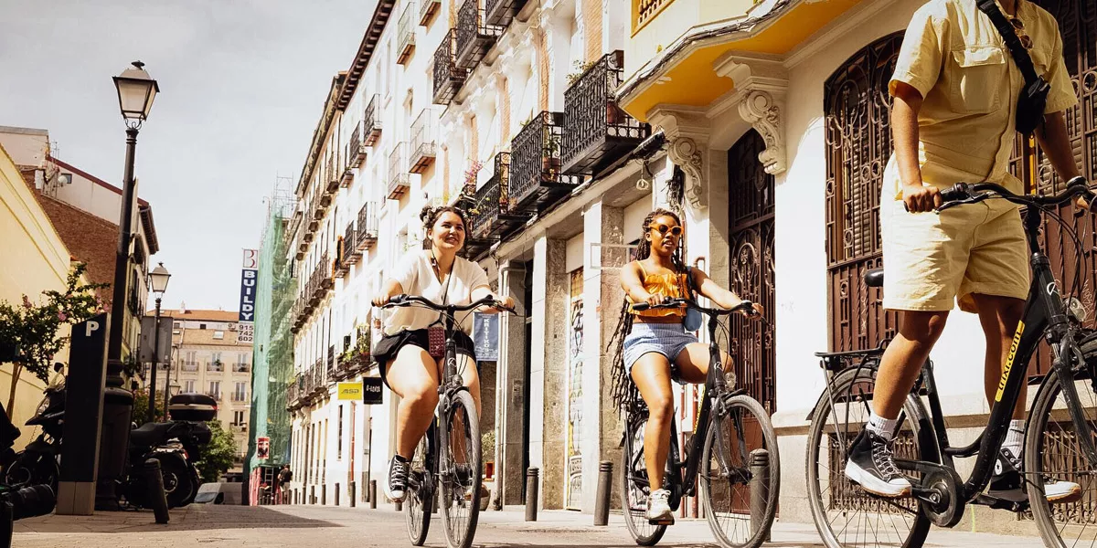 Group Of Friends Riding A Bike In A City