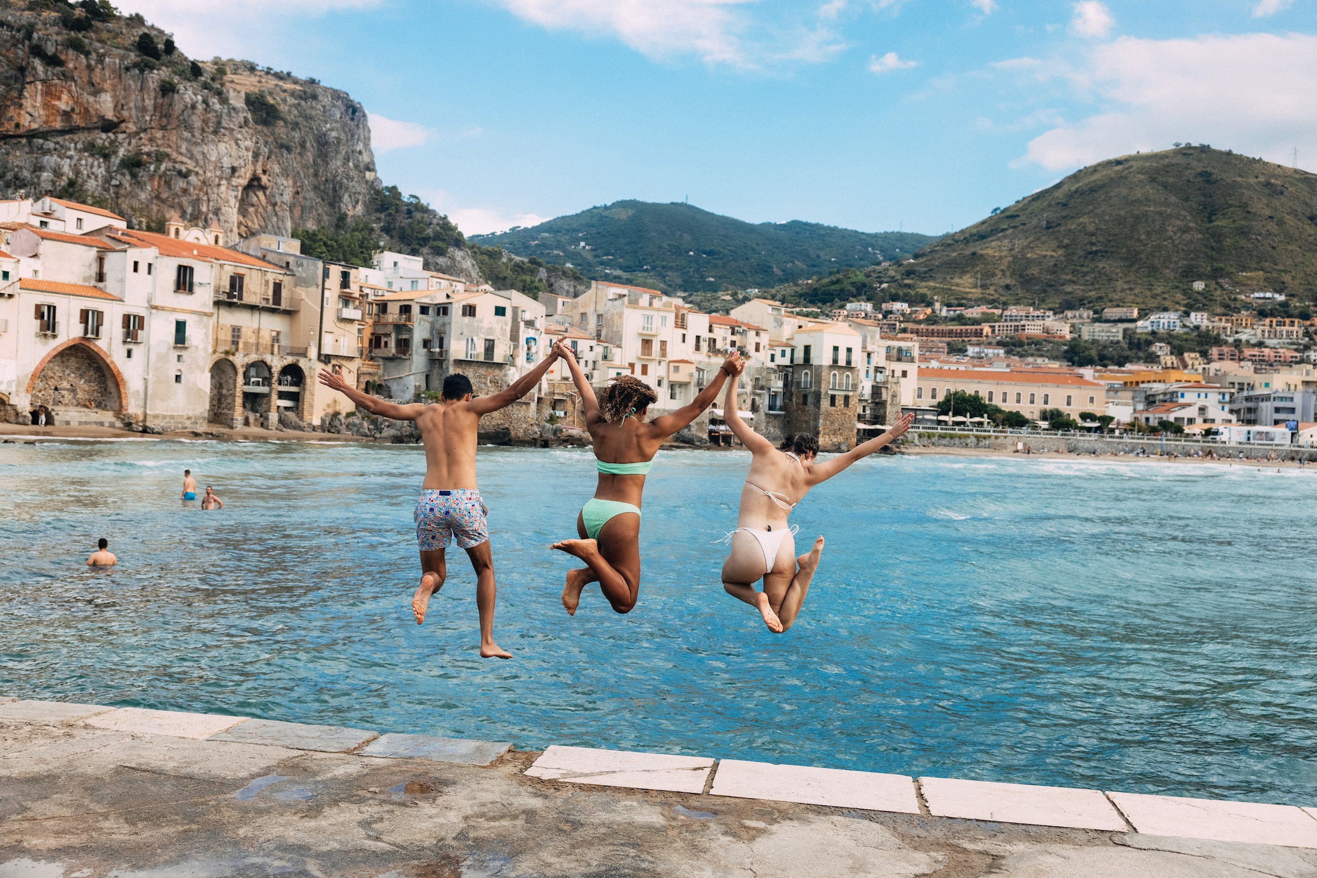 Travelers Jumping into Sea, Cefalu, Sicily, Italy