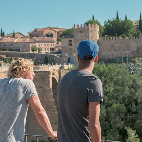 Two people enjoying views of Toledo's medieval old town - Contiki Madrid to Marrakesh Tour