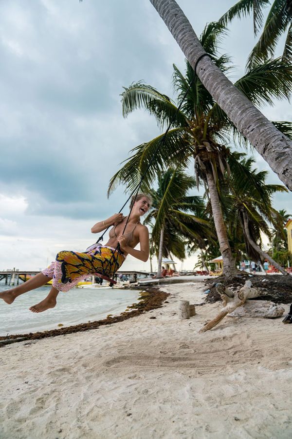 Girl On Swing On Beach In Belize