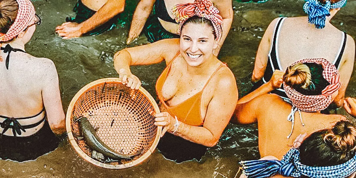 People In A River Woman Holding Barket With A Fish In It