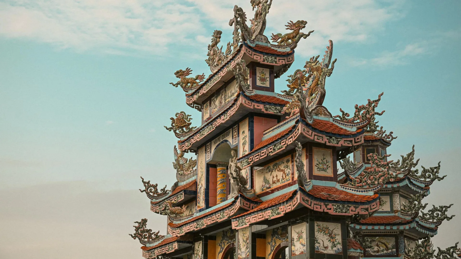 Ornate pagoda at Minh Cung Temple in Vietnam, showcasing traditional architecture - Contiki HCMC, Hoi An & Hanoi Tour