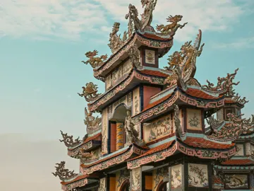 Ornate pagoda at Minh Cung Temple in Vietnam, showcasing traditional architecture - Contiki HCMC, Hoi An & Hanoi Tour