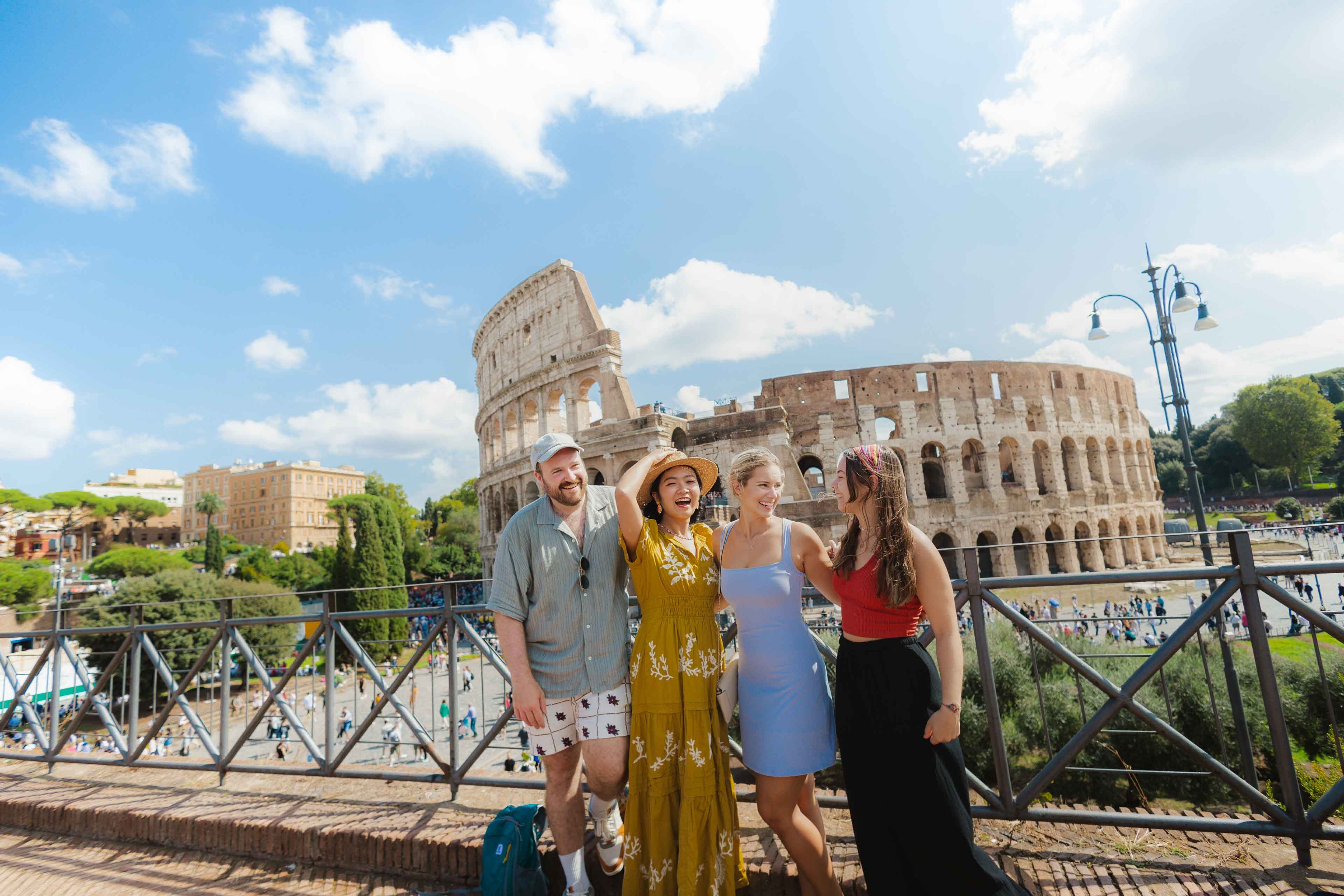 Group Of Young Contiki Travelers Enjoying The Colosuem, Rome, Italy