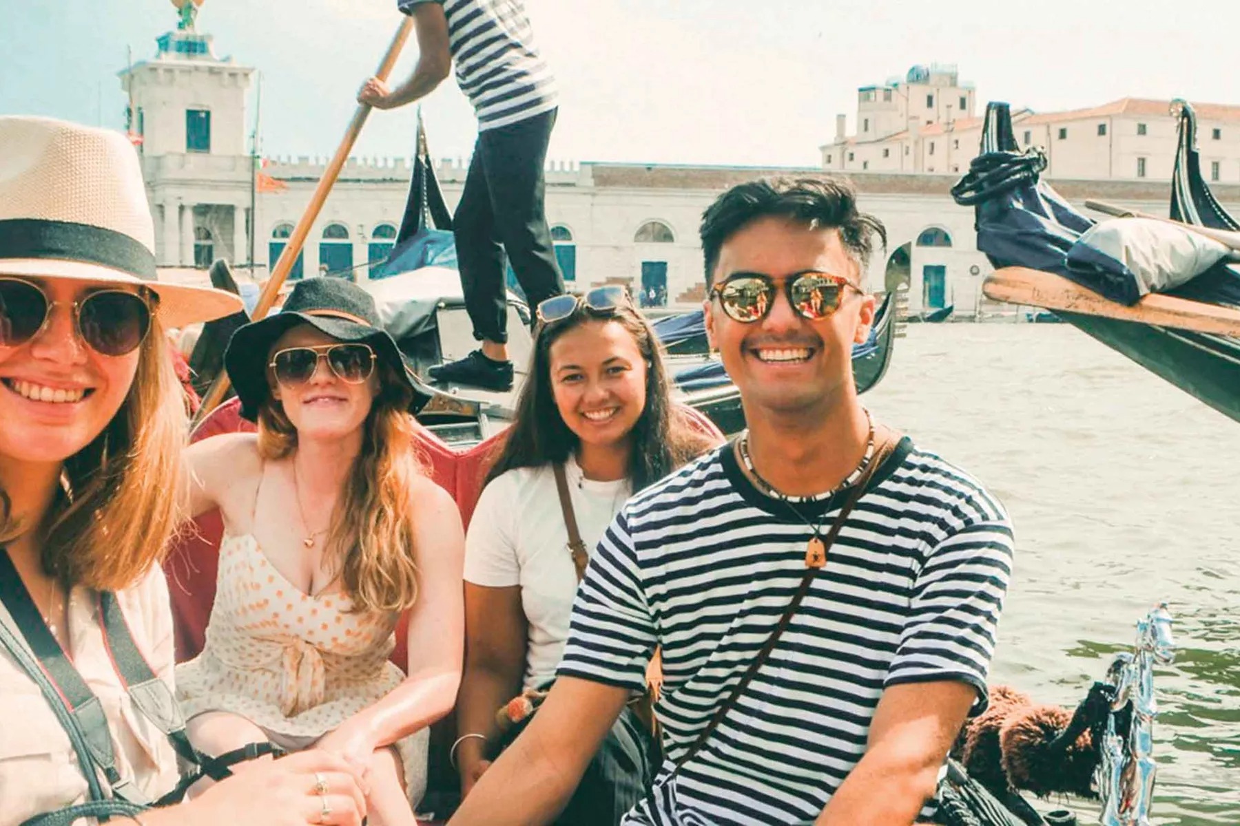 Group On Gondalla Exploring Venice Italy