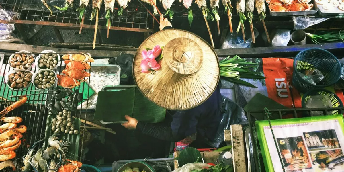 Woman Serving Food In Thai Market