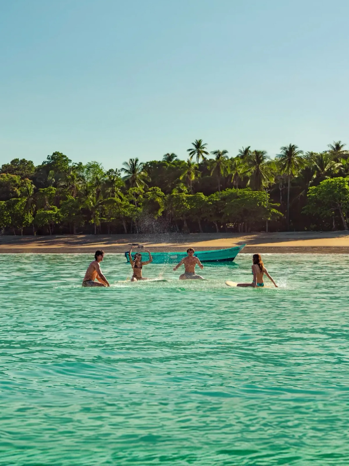 Group of travellers surfing in Costa Rica in January