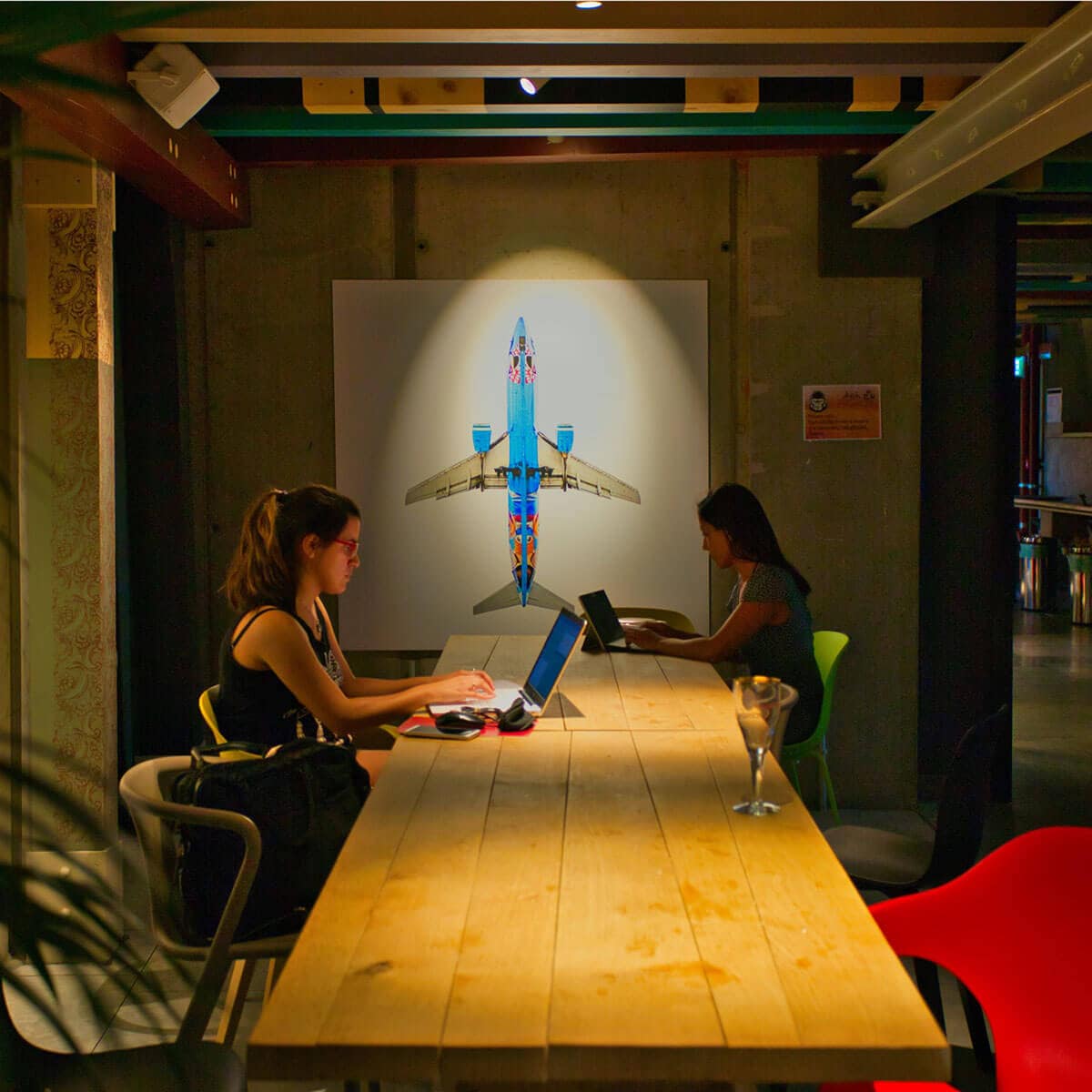 Two girls working on their computers
