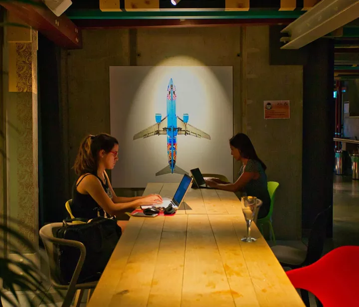 Two girls working on their computers