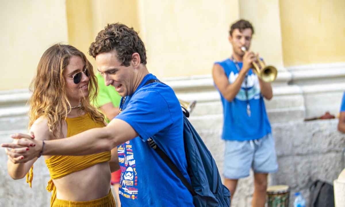 A couple is dancing in the streets of Europe