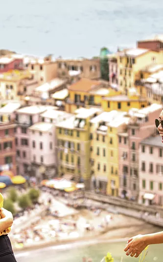 Six travellers laughing with trees in the background