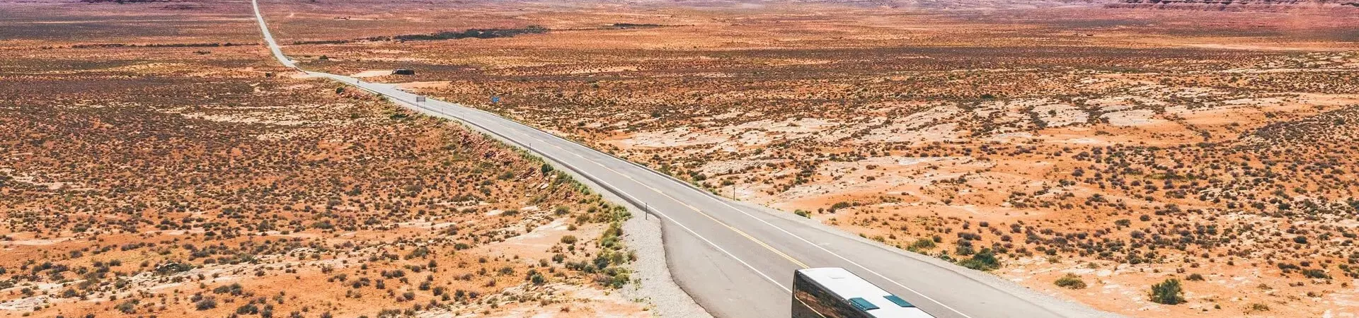 A bus travelling through the desert