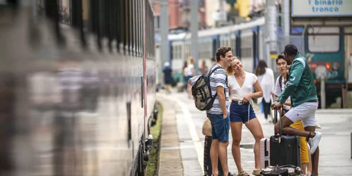 Contiki Travelers Waiting On Platform Train