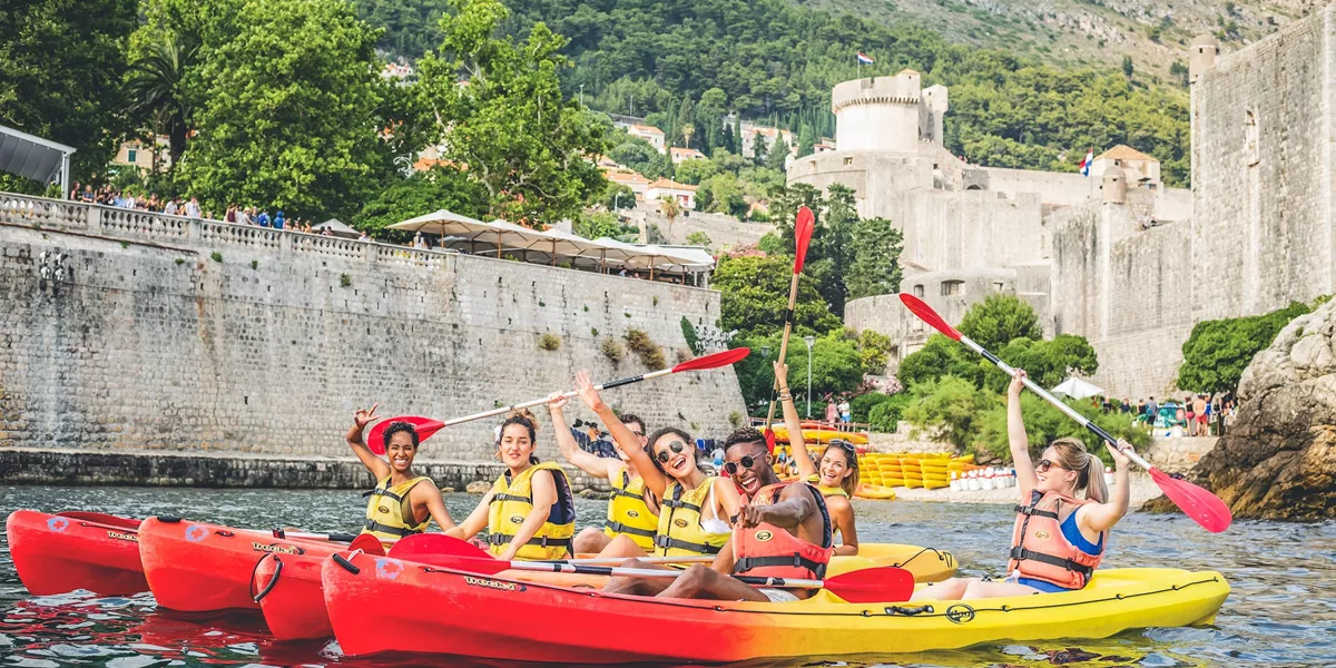 Travellers kayaking in Dubrovnik, Croatia