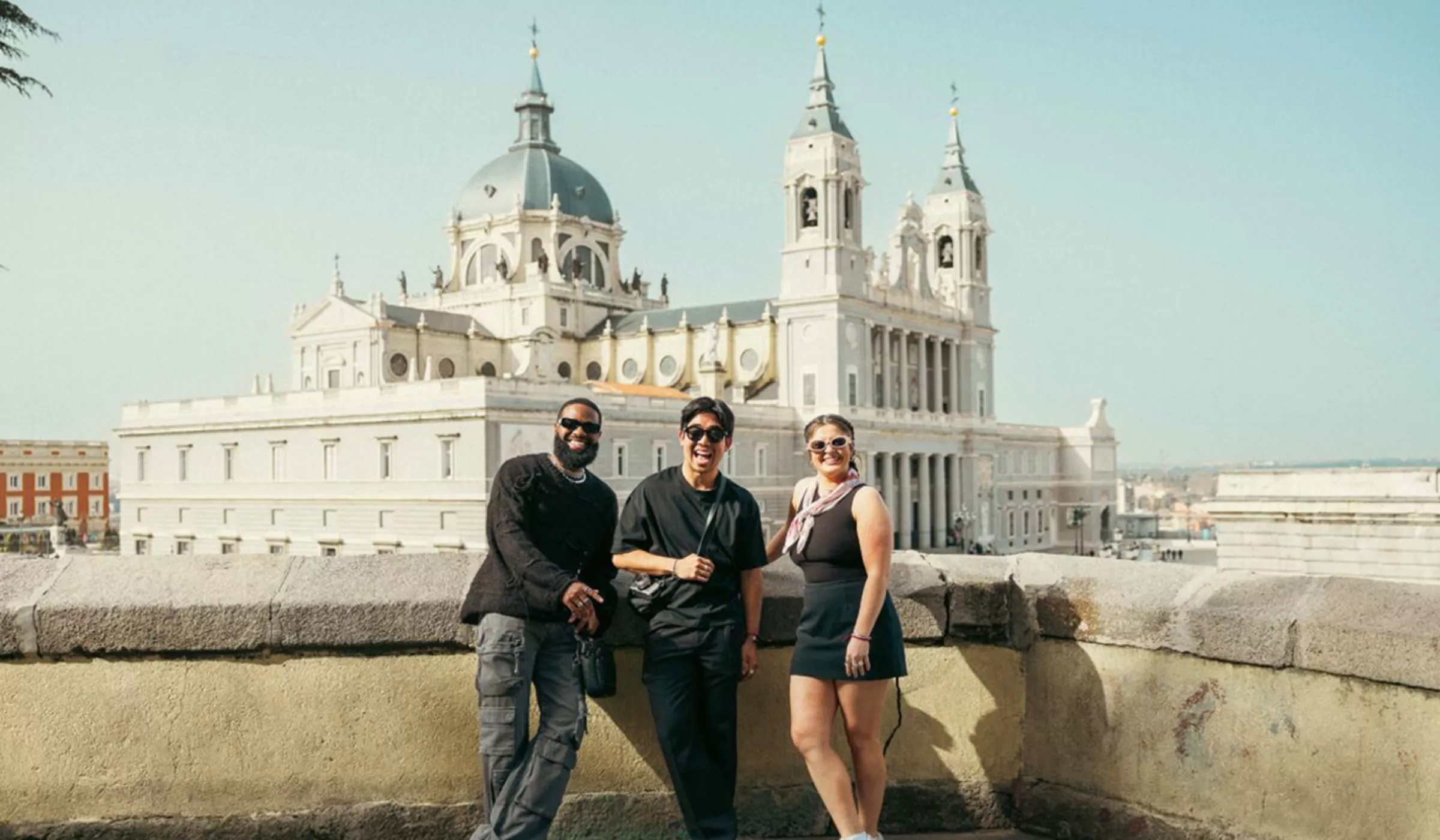Friends Stood In Front Of Almudena Cathedral In Madrid Spain