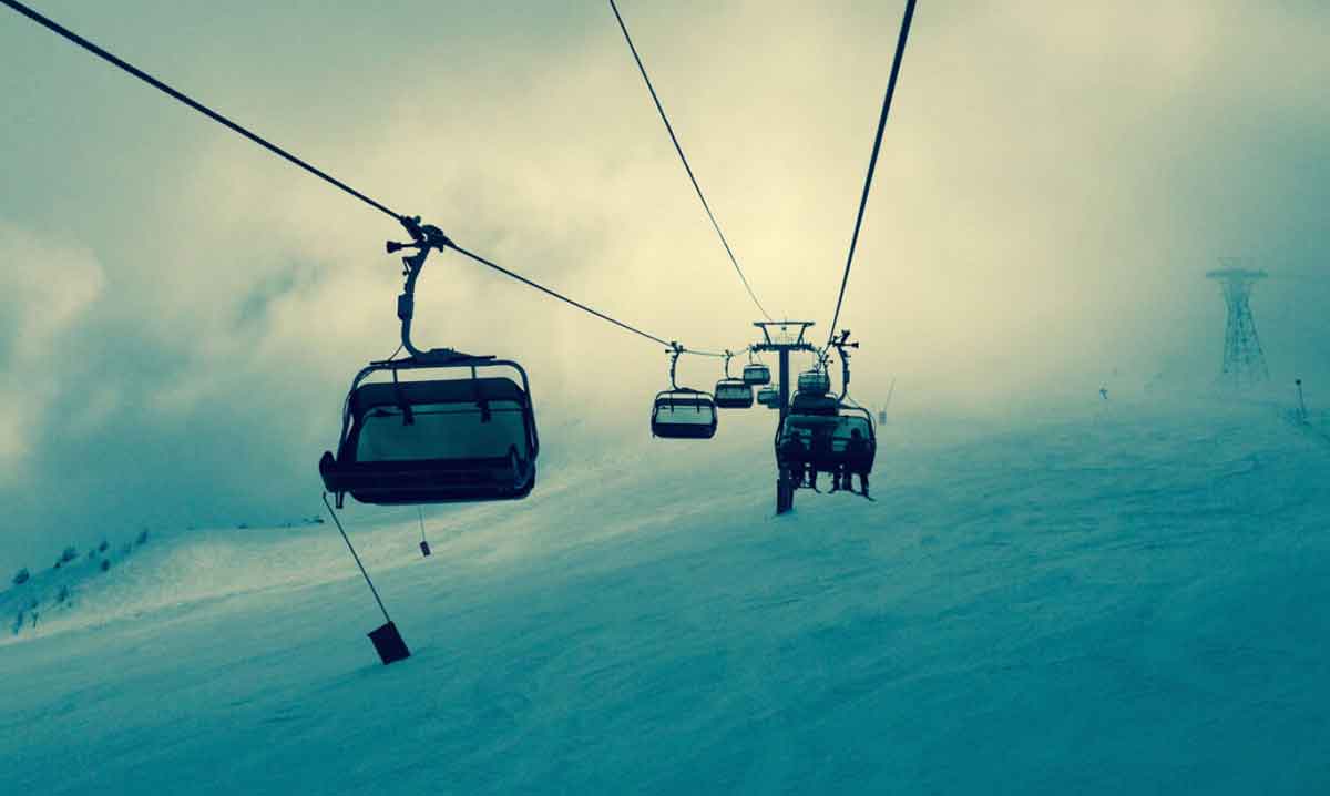 Young Female Skier In Snowy Mountains Austria