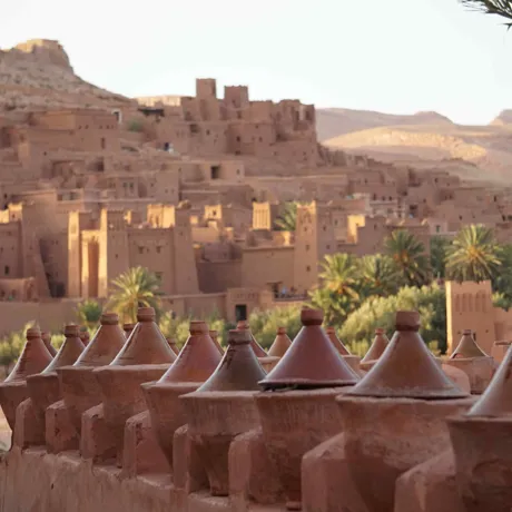 Traditional clay products in the foreground, Moroccan buildings in the background