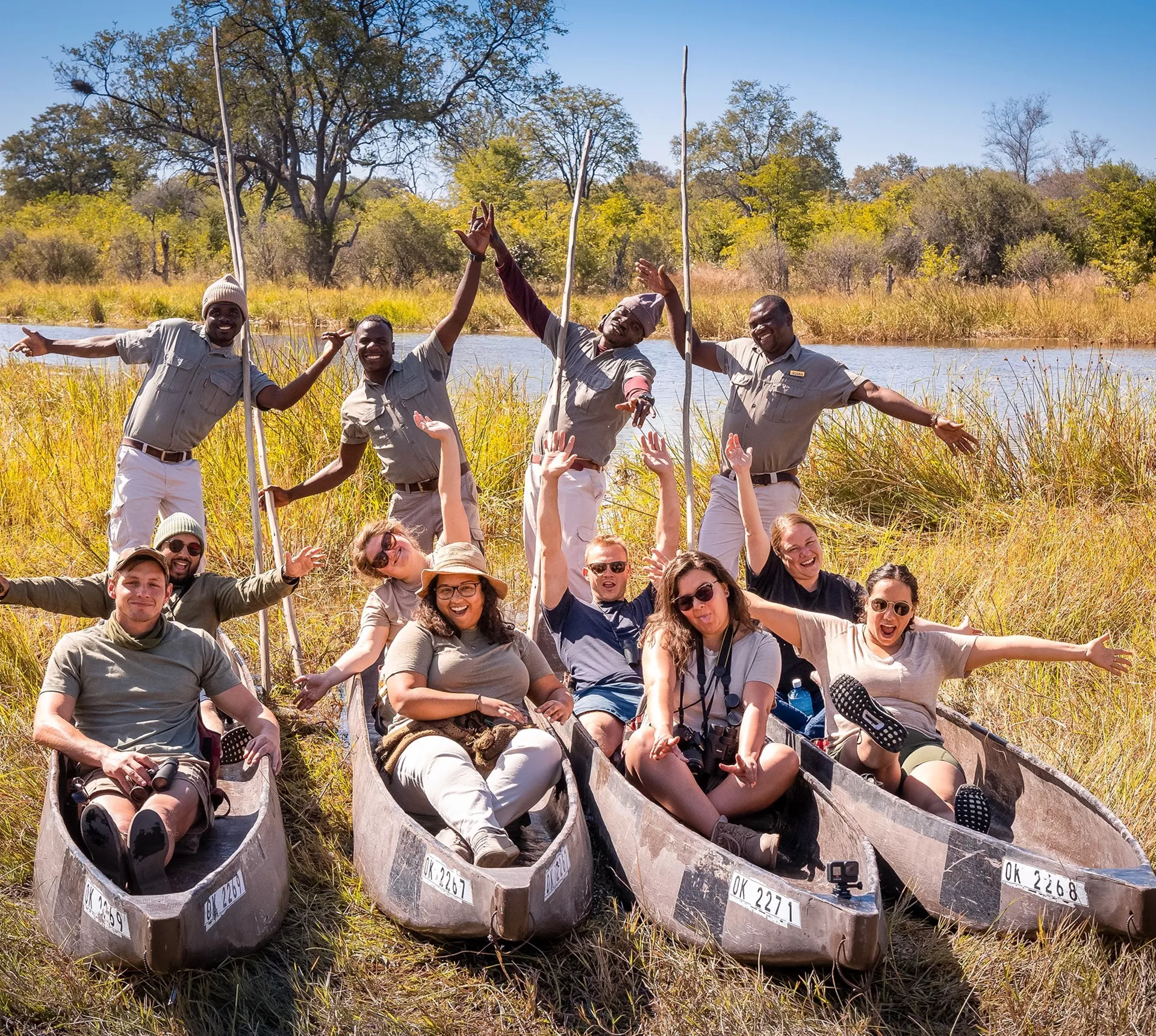 Travellers enjoying a poling boat ride on the Okavango Delta