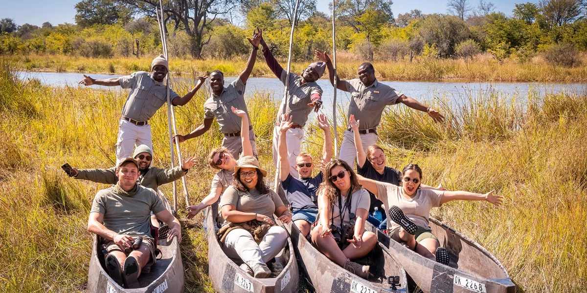 Travellers enjoying a poling boat ride on the Okavango Delta