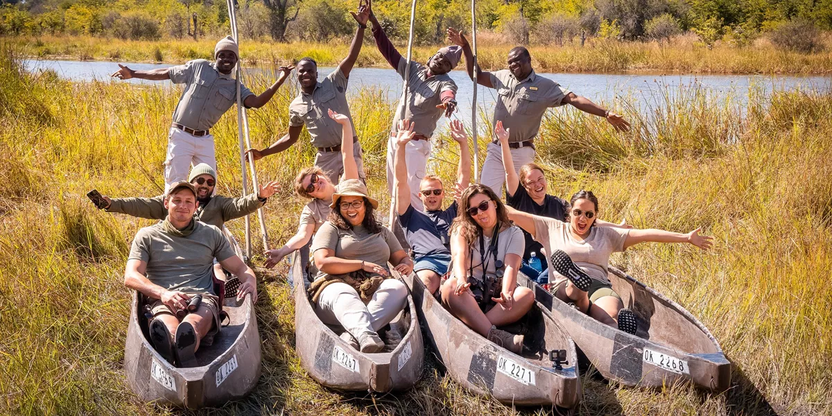 Travellers enjoying a poling boat ride on the Okavango Delta