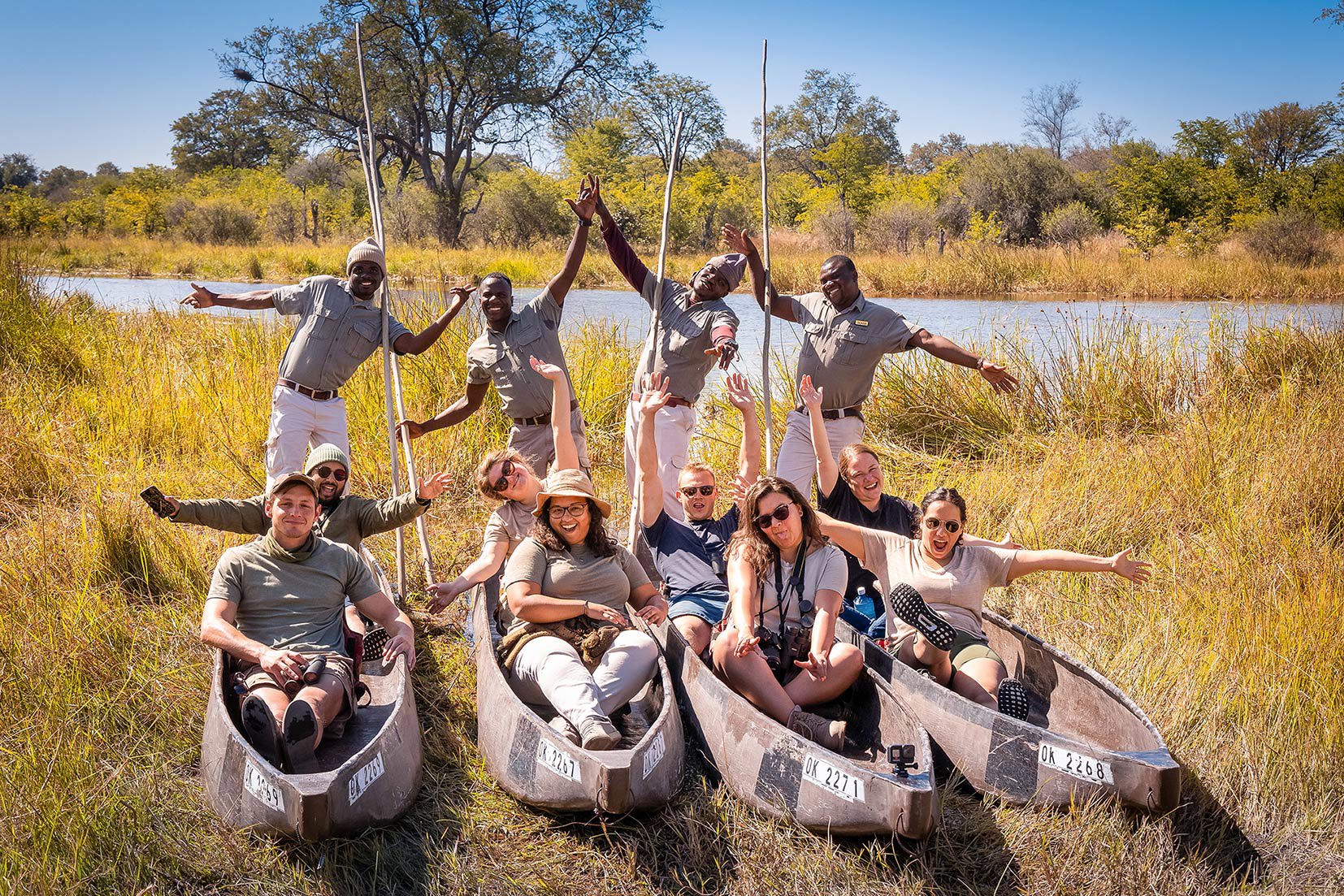 Travellers enjoying a poling boat ride on the Okavango Delta