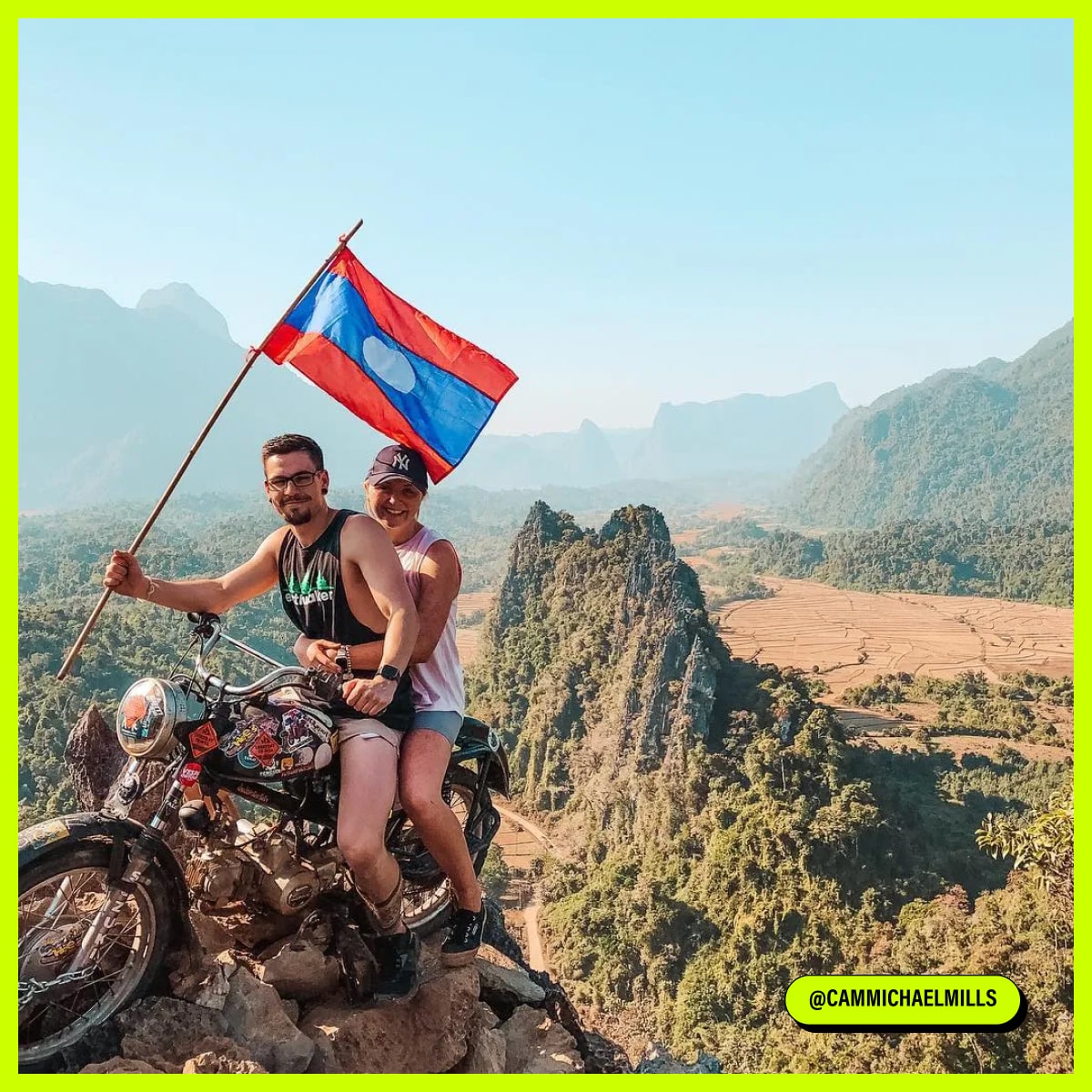 Couple with a flag on the motocycle