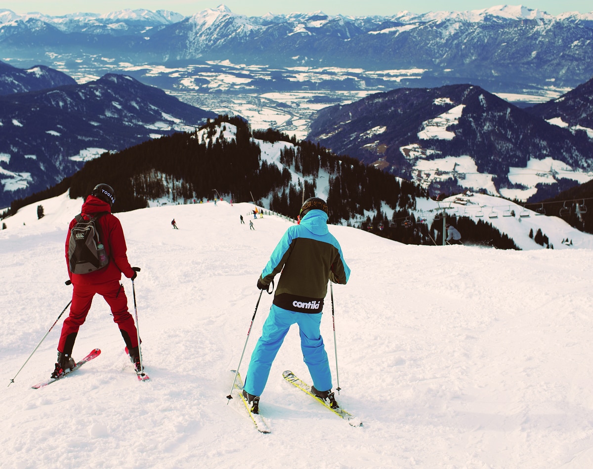 Manager Guiding Traveller Down Slopes Skiing Austria