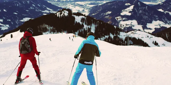 Manager Guiding Traveller Down Slopes Skiing Austria