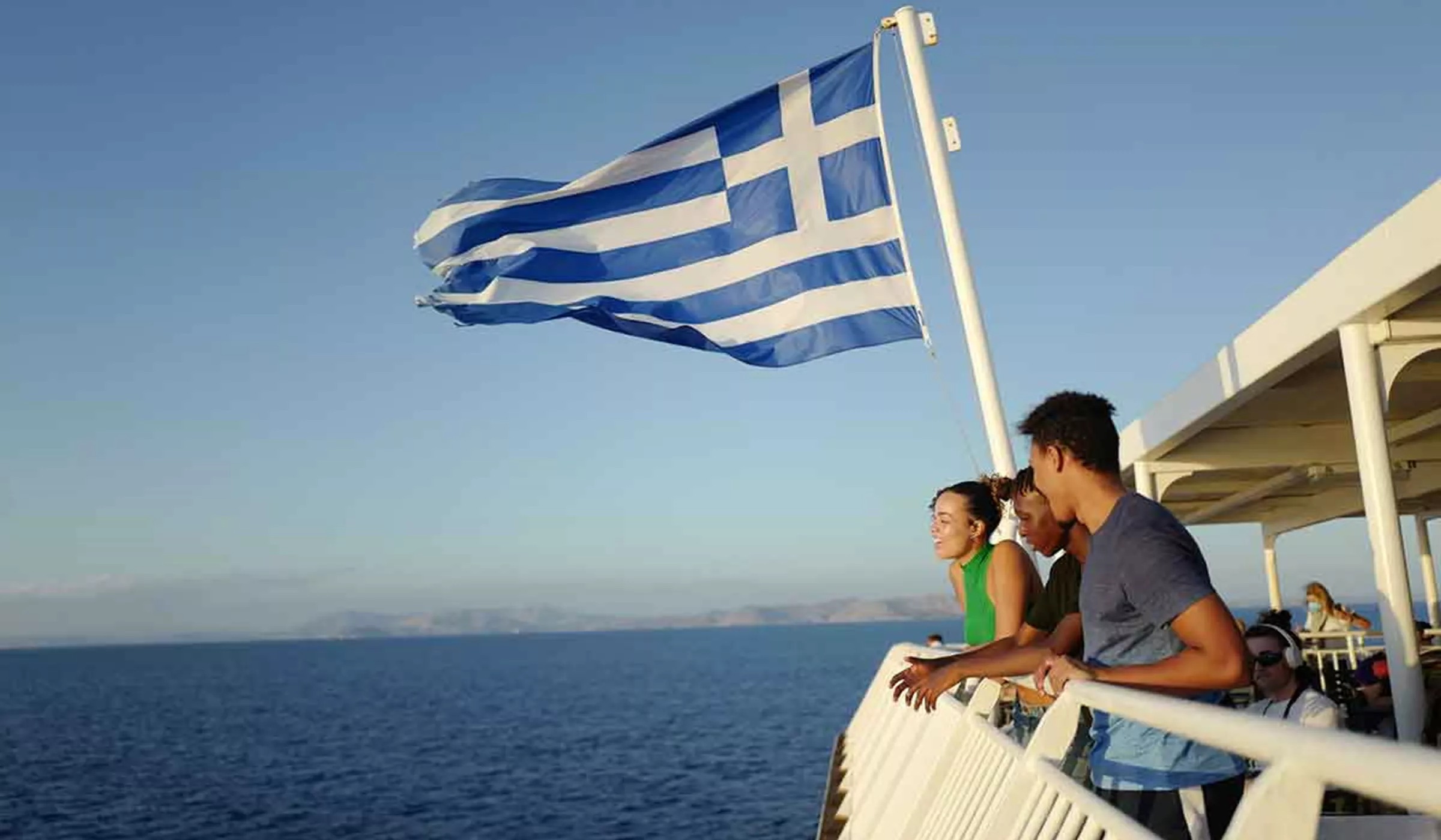 Greek Flag Travelers On Boat Greece