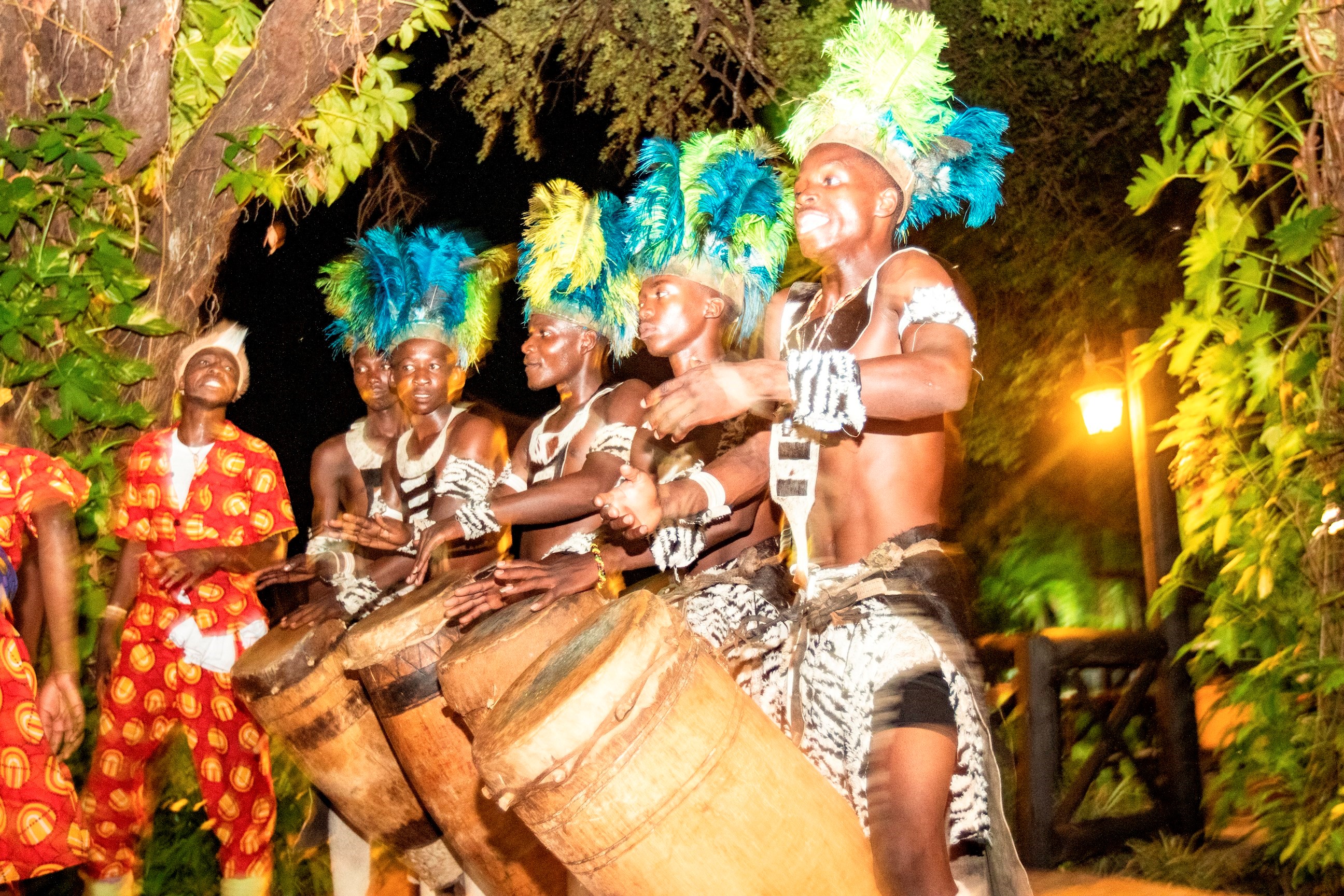 Locals playing drums at night at Victoria Falls, Zambia