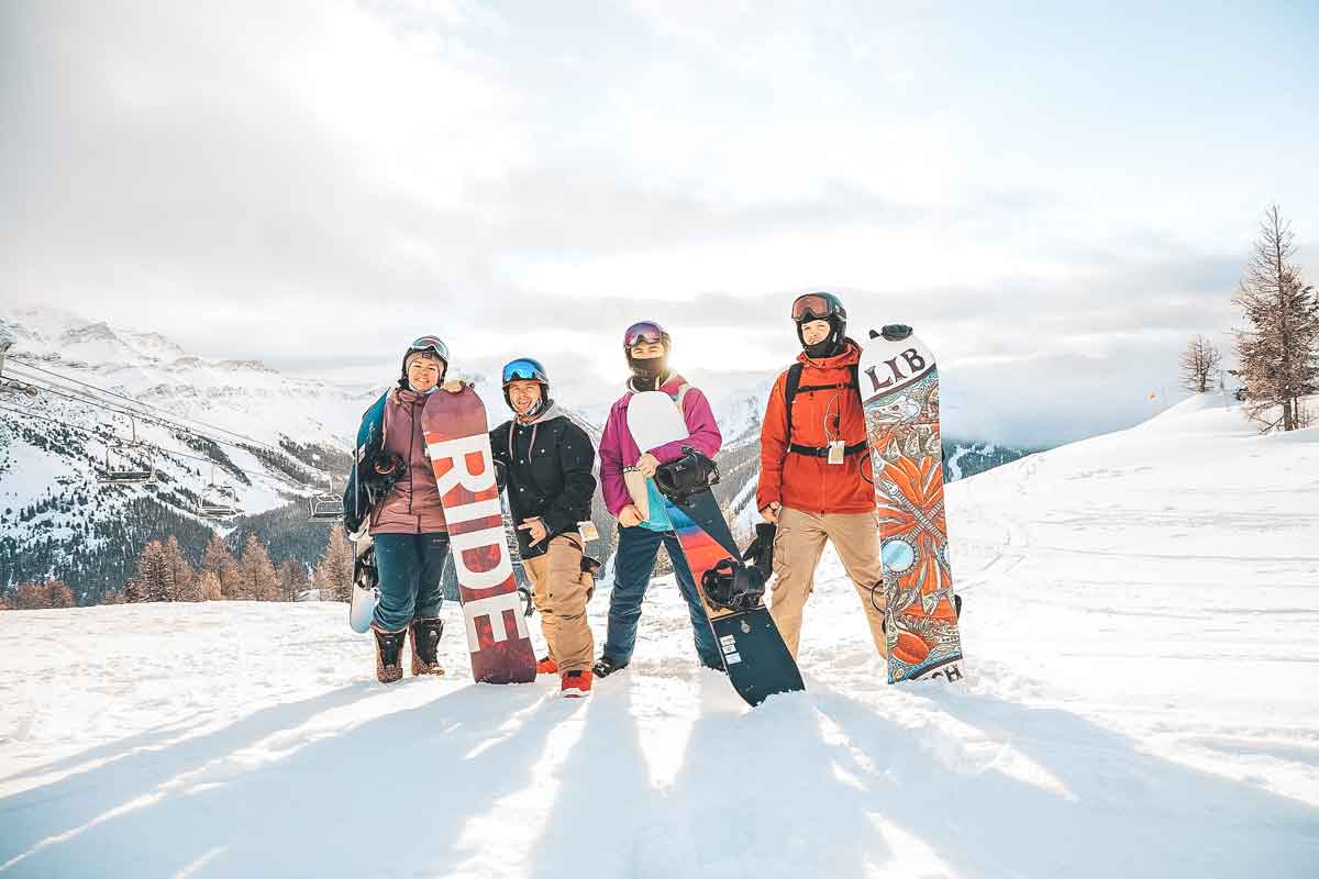 Group Of Snowboarders In Canada Mountains 0002AMER2020