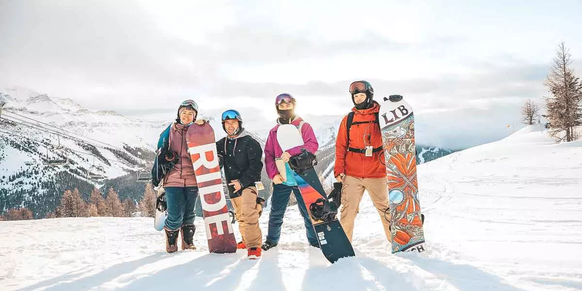 Group Of Snowboarders In Canada Mountains 0002AMER2020