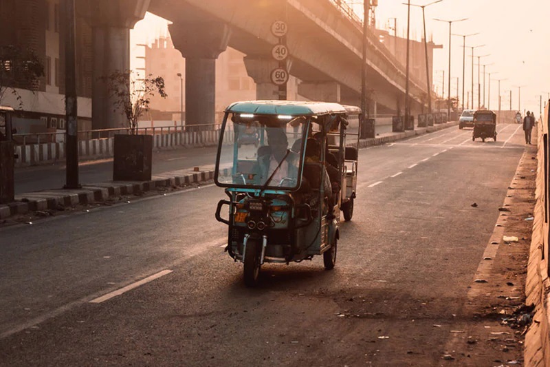 Driving tuktuk on streets of Asian city