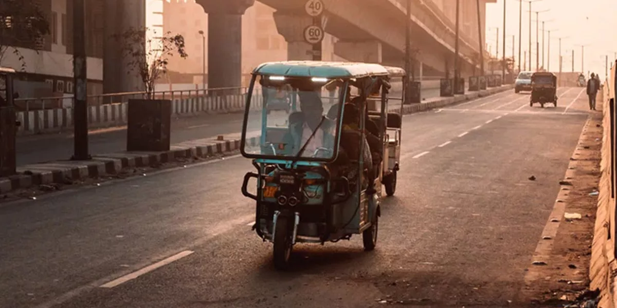 Driving tuktuk on streets of Asian city
