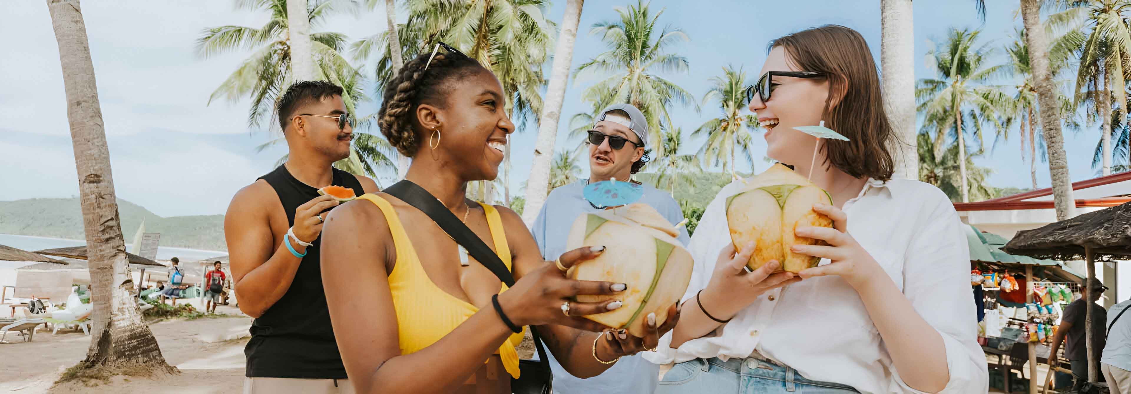 Group Of Friends Enjoying Philippines Drinking Coconut Drinks