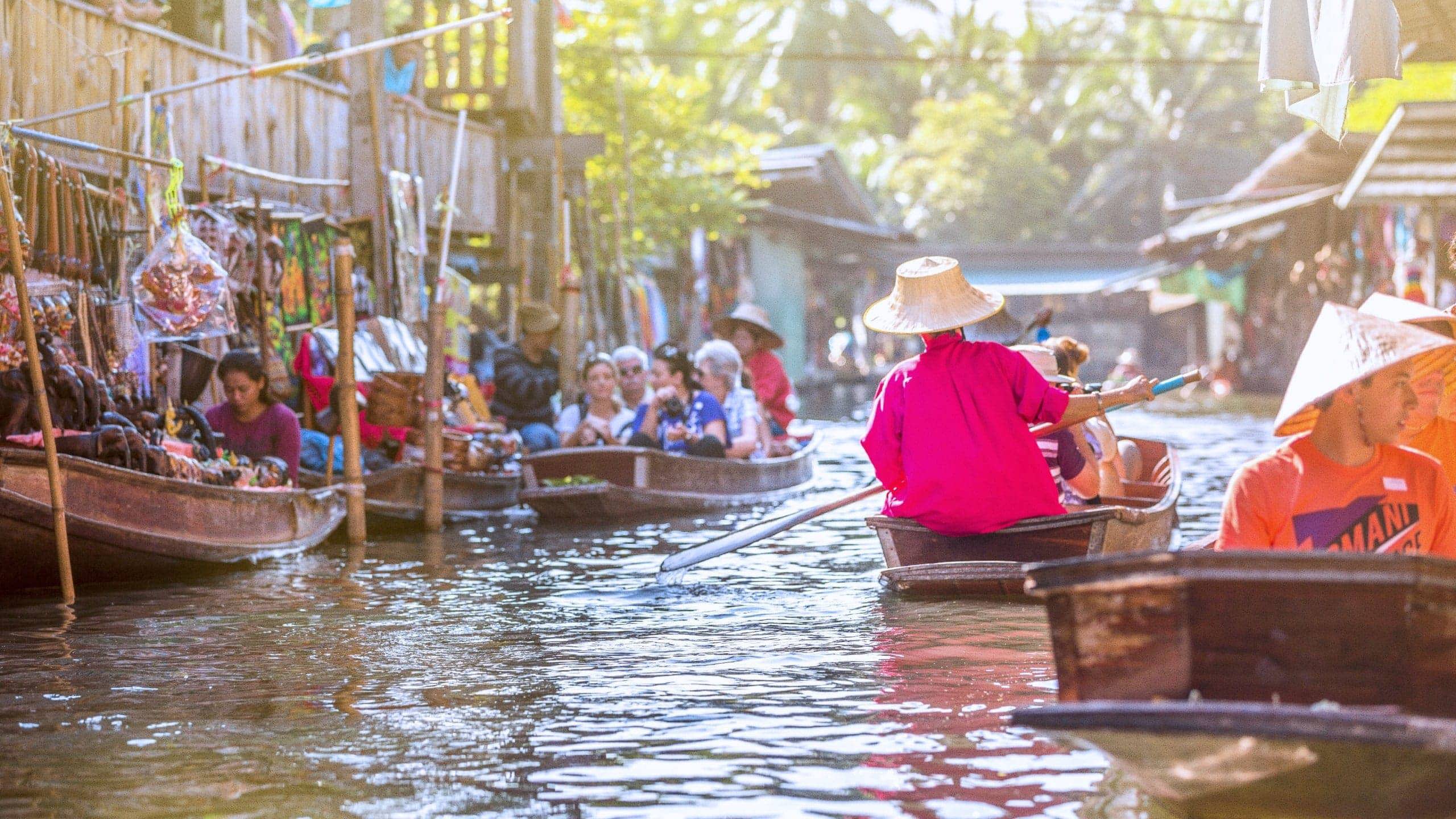 Traditional floating market on Bangkok's canals in Thailand - Contiki Bangkok to Luang Prabang Tour